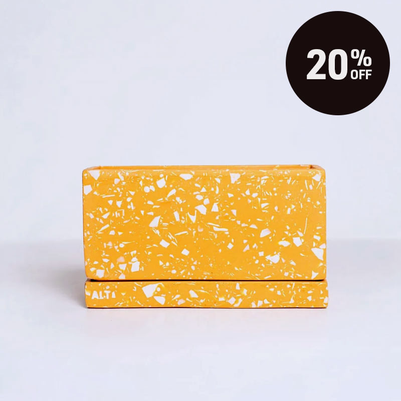 A rectangular Orange Terrazzo Plant Pot: Handmade Jesmonite Concrete Planter with Drainage and Saucer with a black circular '20% OFF' promotional badge in the top right corner.