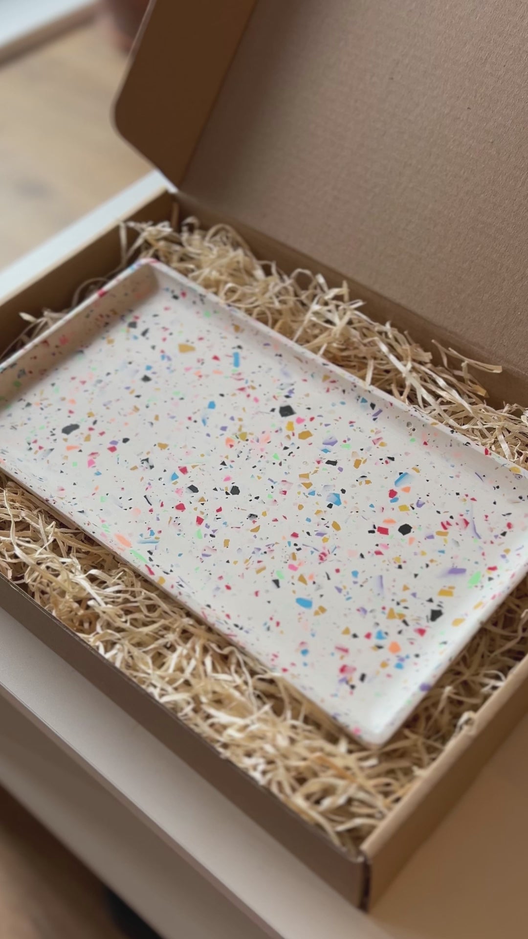 Rectangular tray with an eco brown packaging box with ALT Hackney logo
