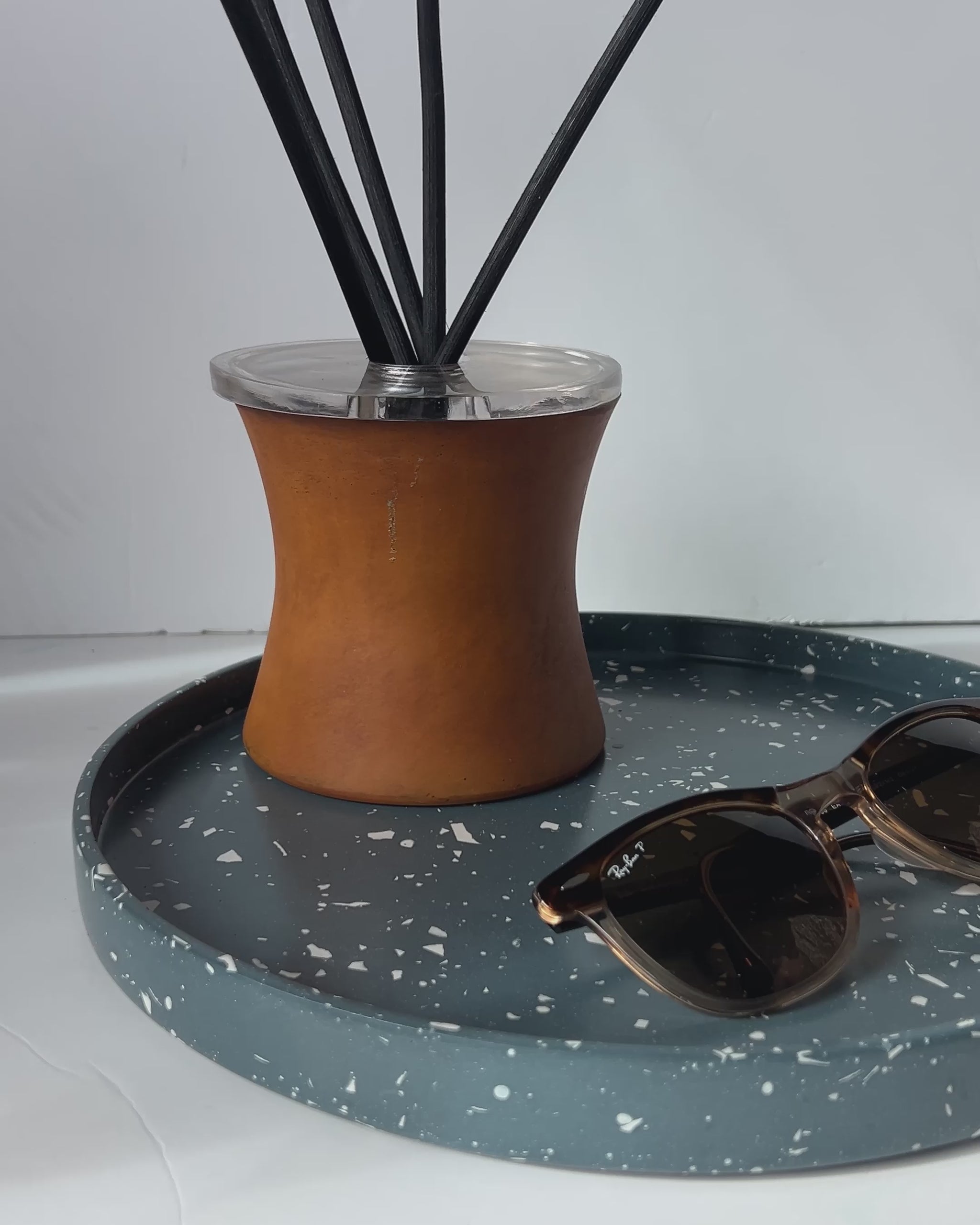 Large Round Navy terrazzo Tray with Diffuser and a pair of Rayban glasses