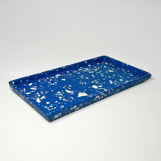 Blue tray with white terrazzo on a light grey background