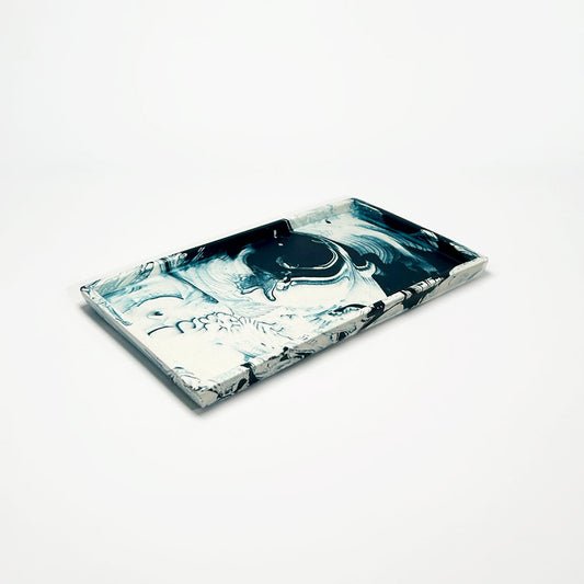 Marble-patterned rectangular tray on a light gray background