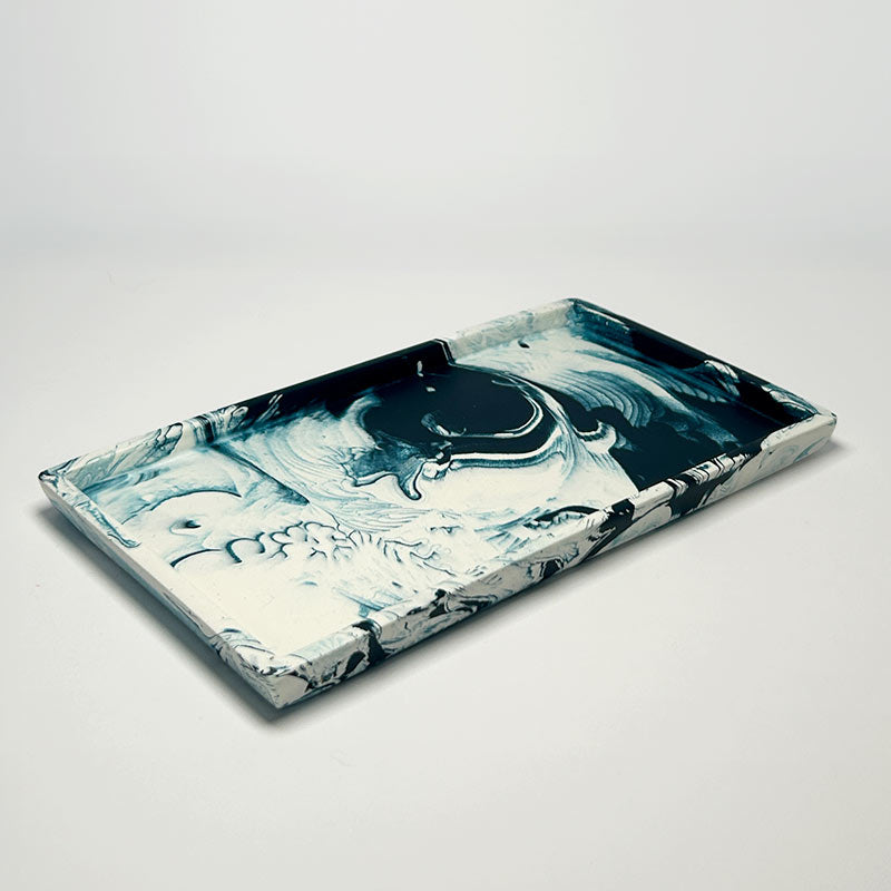 Marble-patterned rectangular tray on a light gray background