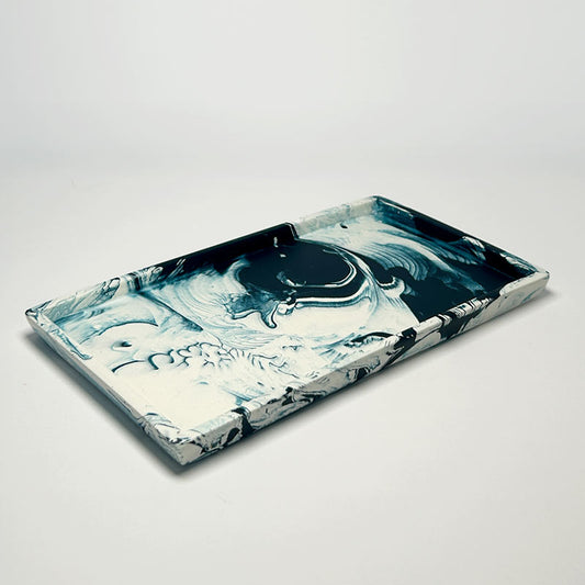Marble-patterned rectangular tray on a light gray background