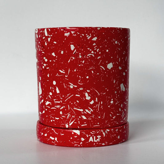 Red with white terrazzo planter with 'ALT' branding on a white  background