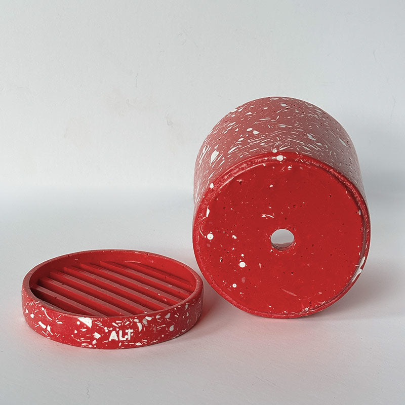 Red with white terrazzo planter with 'ALT' branding on a white  background