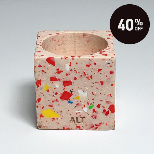 Pink with colourful rainbow confetti terrazzo rectangular tea light candle holder on a light grey background with 40% off badge