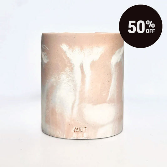 Marble-patterned salmon pink pen pot with 'ALT' branding on a white background with 50% off promotion on the top right corner