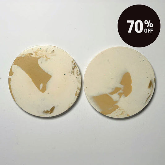 Two round coasters with a cream and tan marbled design, displayed side-by-side on a light gray background with a black '70% OFF' promotional badge in the top right corner.