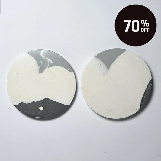 Two round ceramic coasters with a gray and off-white marbled pattern, displayed on a light gray background with a black '70% OFF' promotional badge in the top right corner.