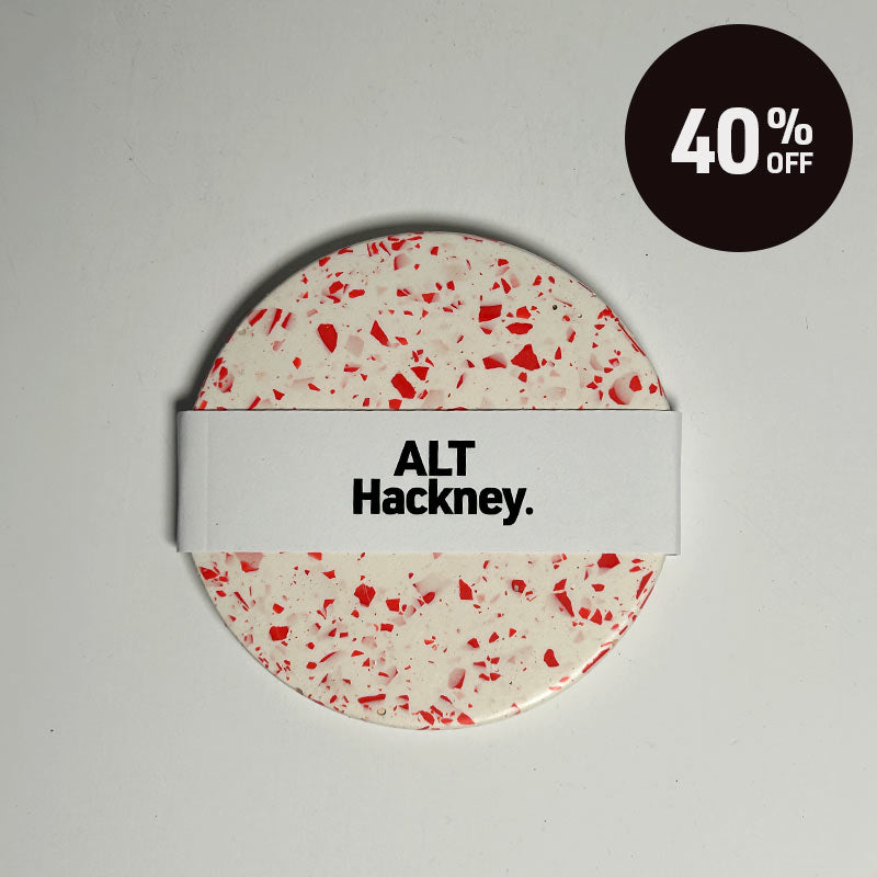 Red terrazzo coaster on a white background with 40% off promotion badge on top right corner