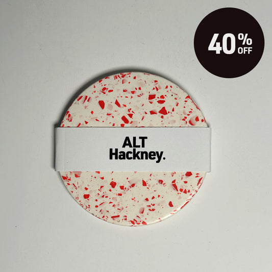 Red terrazzo coaster on a white background with 40% off promotion badge on top right corner