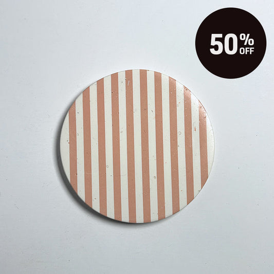 A round coaster with vertical peach and white stripes, shown on a light gray background with a black circular '50% OFF' promotional sticker in the top right corner.