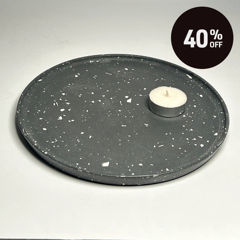 A round black tray with a white terrazzo speckled pattern, shown on a light gray background with a black circular '40% OFF' promotional badge in the top right corner.