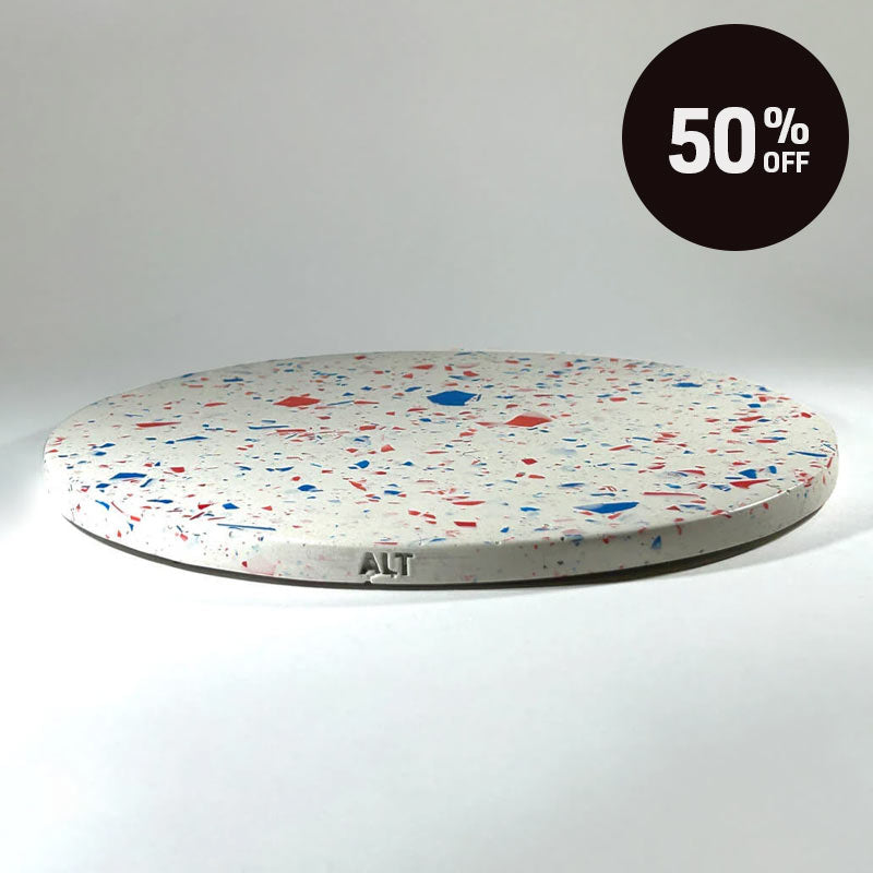 A round terrazzo tray with a white base and red and blue chips, shown on a white background with a black '50% OFF' promotional badge in the top right corner.