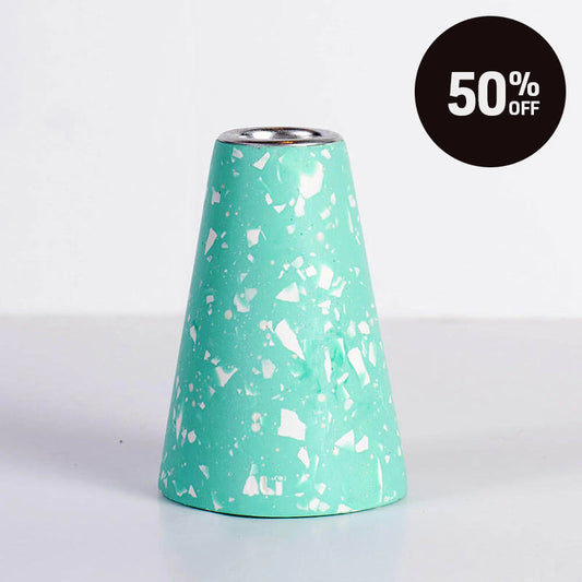 A mint green and white terrazzo-patterned taper candle holder with a silver-toned top, shown on a white background with a black '50% OFF' promotional badge in the top right corner.