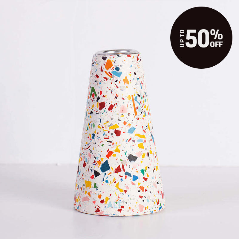 A white and rainbow terrazzo patterned taper candle holder with a silver-toned top, shown on a white background with a black 'Up to 50% OFF' promotional badge in the top right corner.