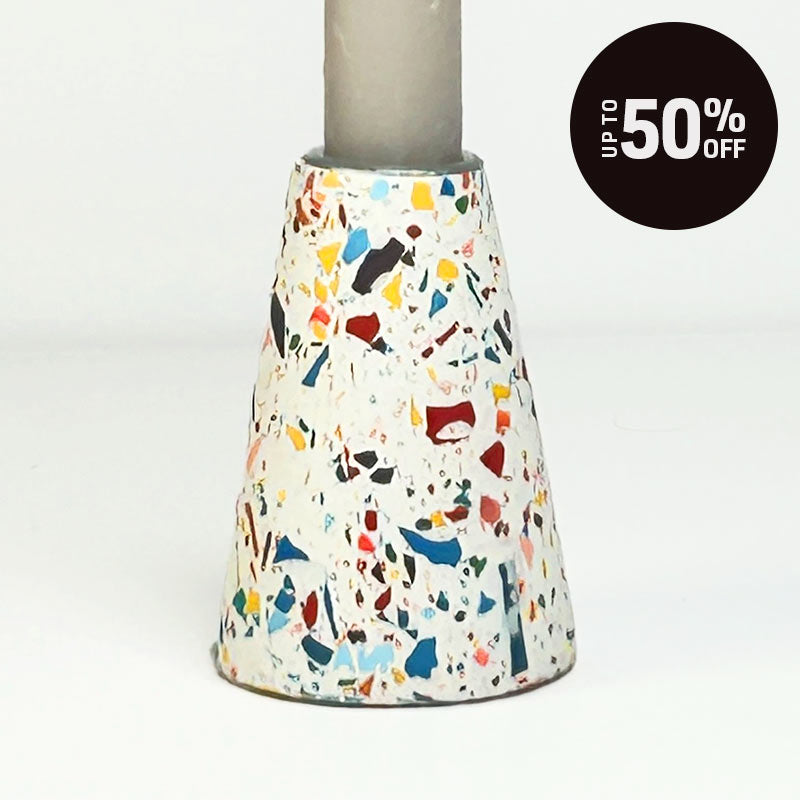 A terrazzo tapered candle holder white with rainbow speckles, shown on a clean white background with a black circular 'Up to 50% OFF' promotional badge in the top right corner.