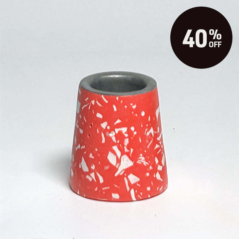 A small tapered red candle holder with a white terrazzo-style speckled pattern, shown on a light grey background with a black '40% OFF' promotional badge in the top right corner.