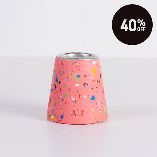 A pink and rainbow terrazzo patterned taper candle holder with a silver-toned top, shown on a white background with a black '40% OFF' promotional badge in the top right corner.