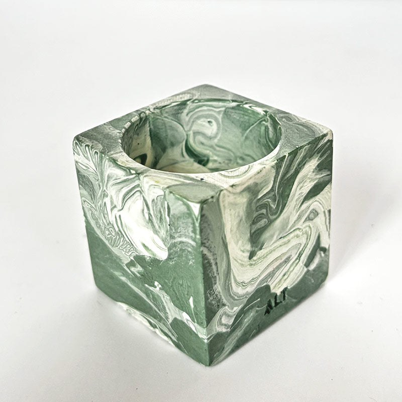 Green and white marble patterned candle holder with 'ALT' branding on a white background
