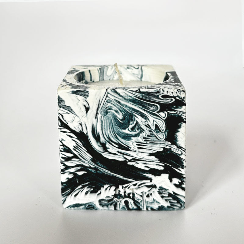 Navy and white marble patterned tea light candle holder with 'ALT' branding on a white background