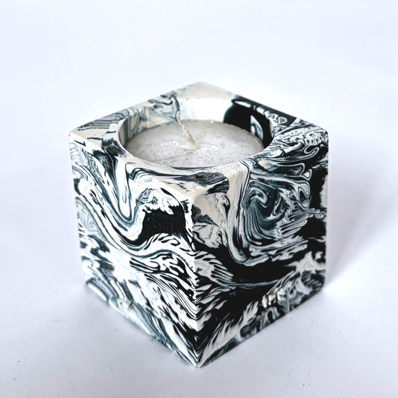 Navy and white marble patterned tea light candle holder with 'ALT' branding on a white background