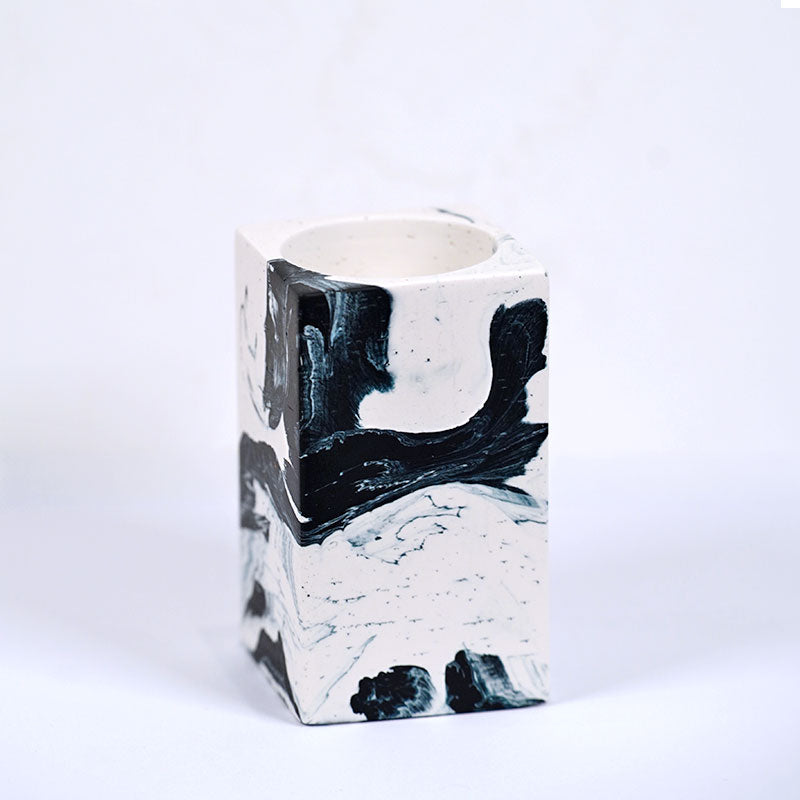 Navy and white marble patterned tea light candle holder with 'ALT' branding on a white background