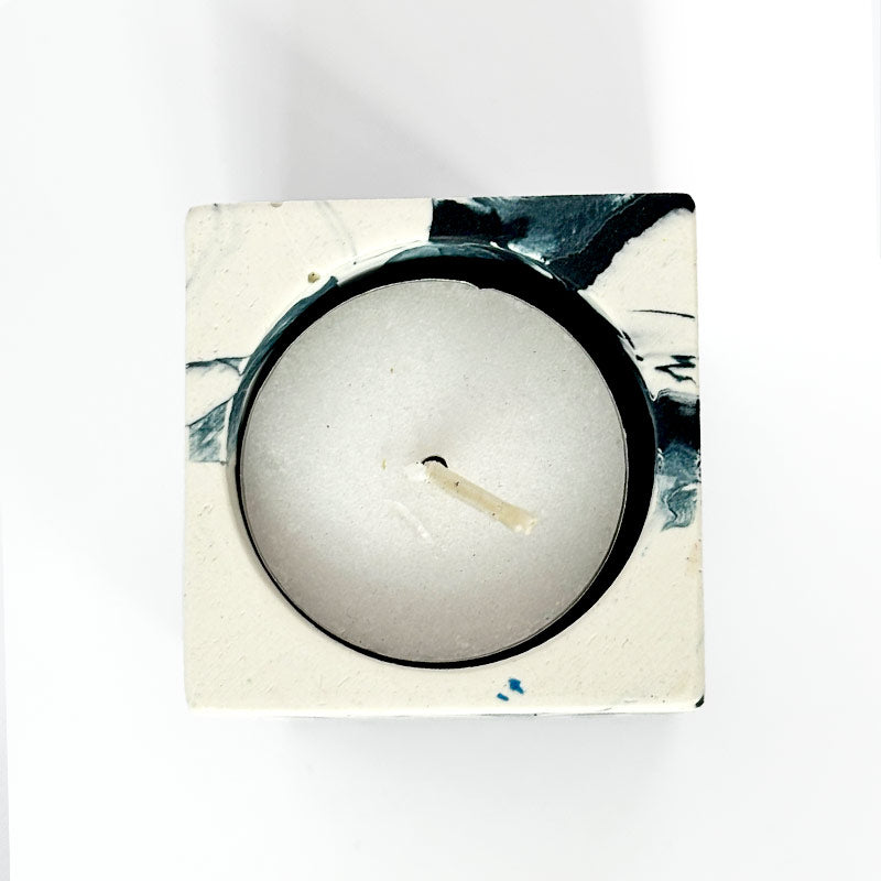Navy and white marble patterned tea light candle holder with 'ALT' branding on a white background