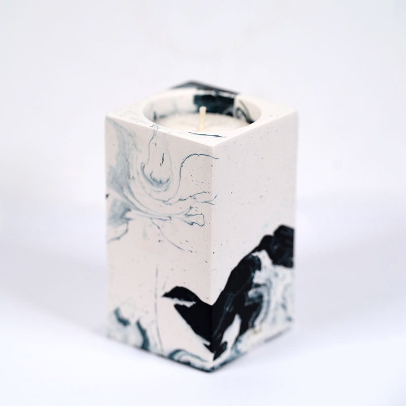 Navy and white marble patterned tea light candle holder with 'ALT' branding on a white background