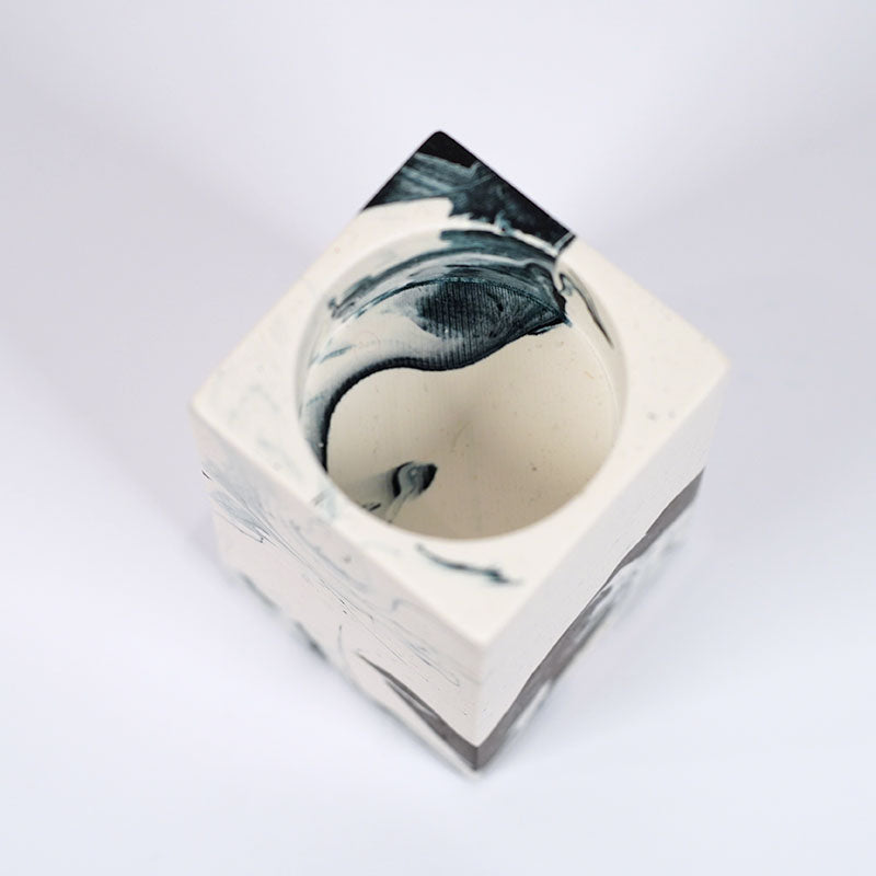 Navy and white marble patterned tea light candle holder with 'ALT' branding on a white background