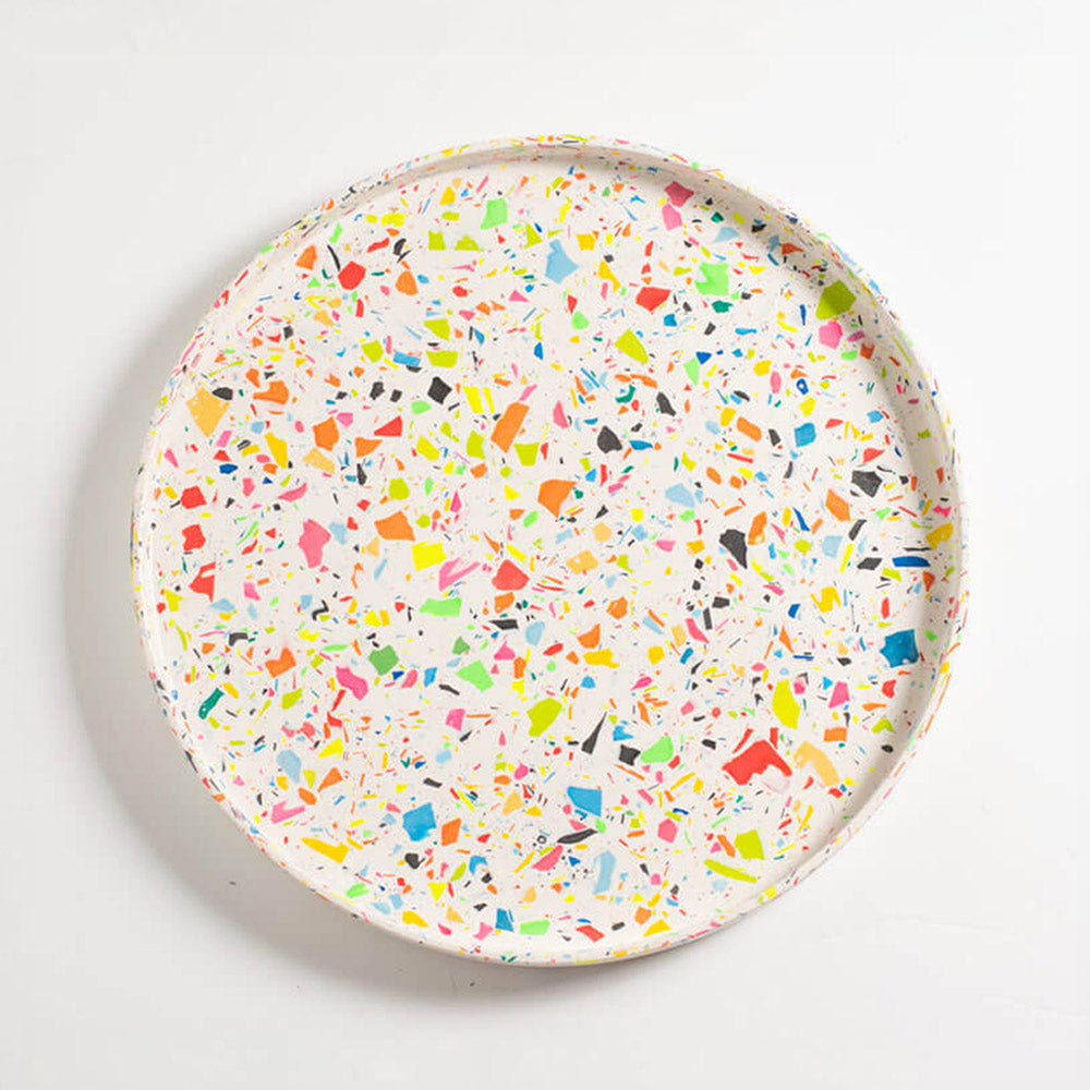 Round rainbow confetti terrazzo Jesmonite decorative tray on a white background