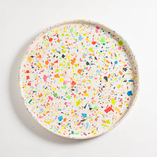 Round rainbow confetti terrazzo Jesmonite decorative tray on a white background