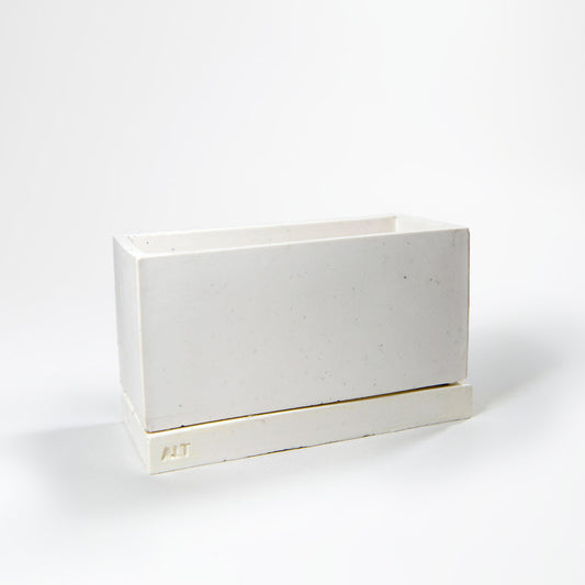 Minimalistic scandi / japandi rectangular grey planter with drainage holes and a water tray box with 'ALT' branding on a white background