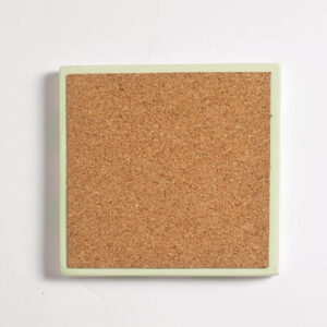 The cork underside of the handcrafted mint green and white checkered square coaster, Jesmonite trinket, or vanity key tray